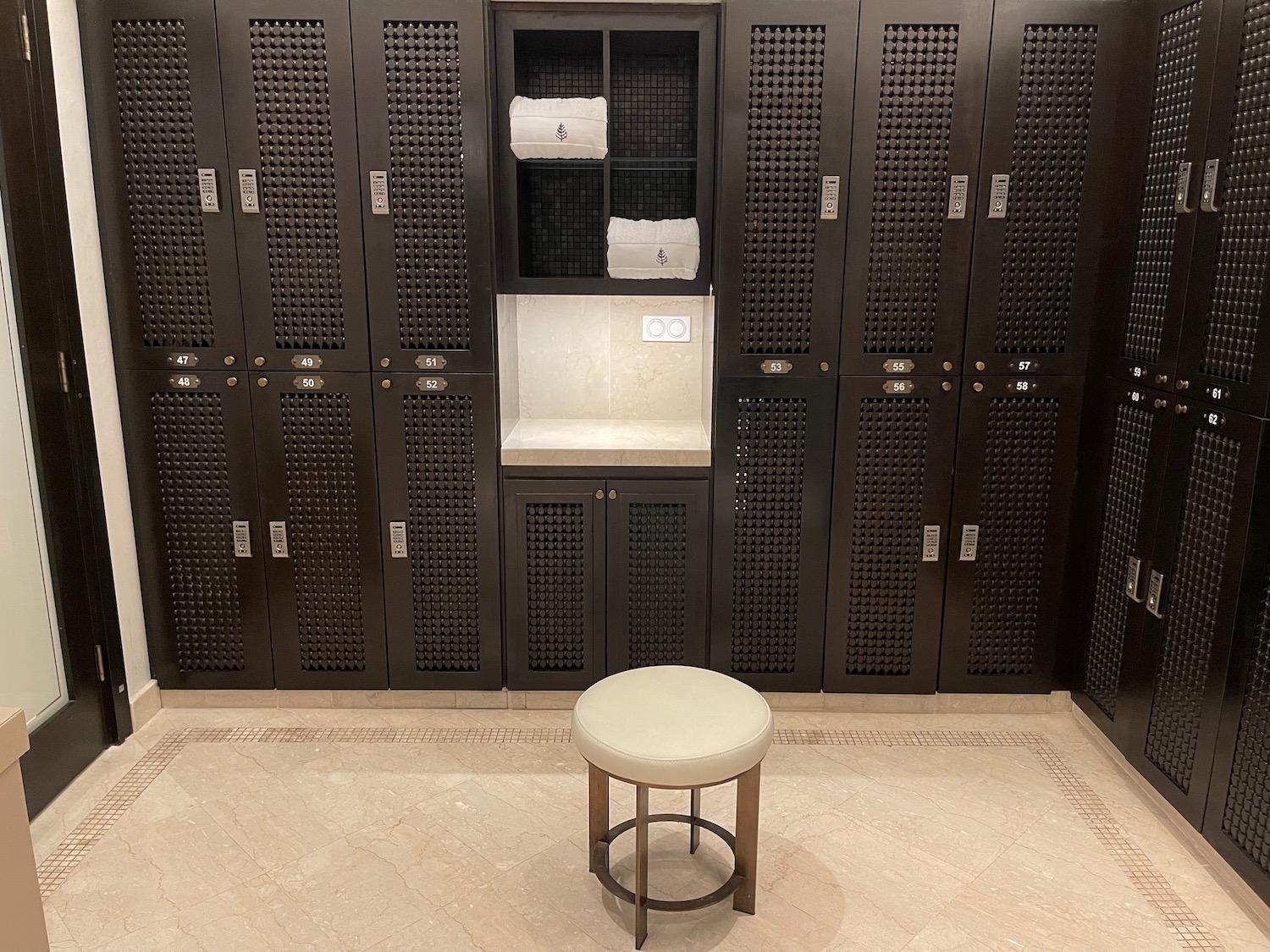 a stool in a room with lockers