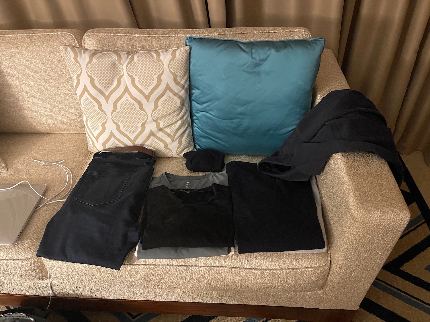 a couch with a few clothes on it