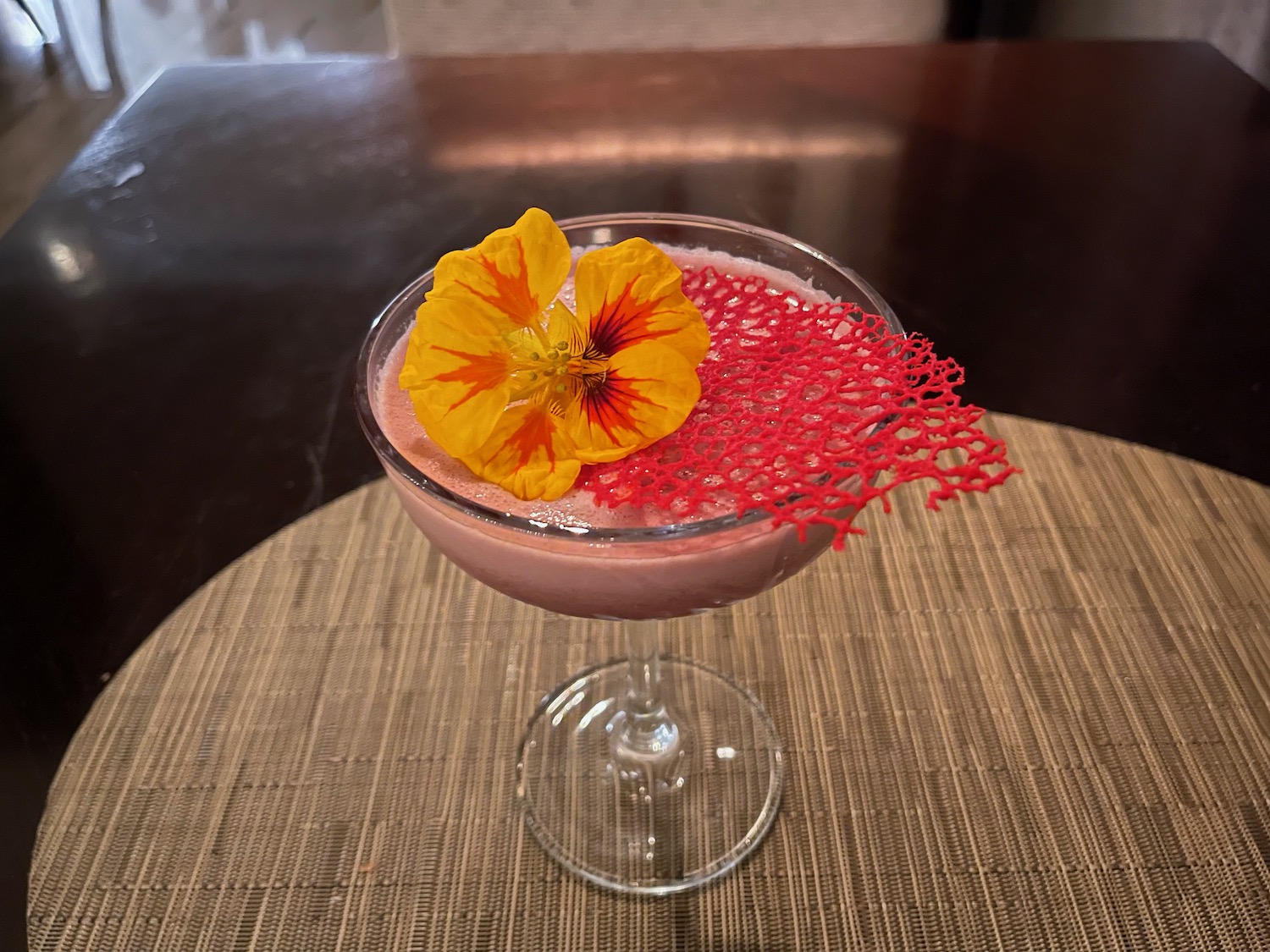 a drink with a flower on top