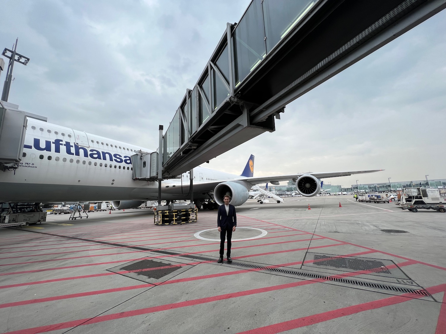 a man standing in front of an airplane