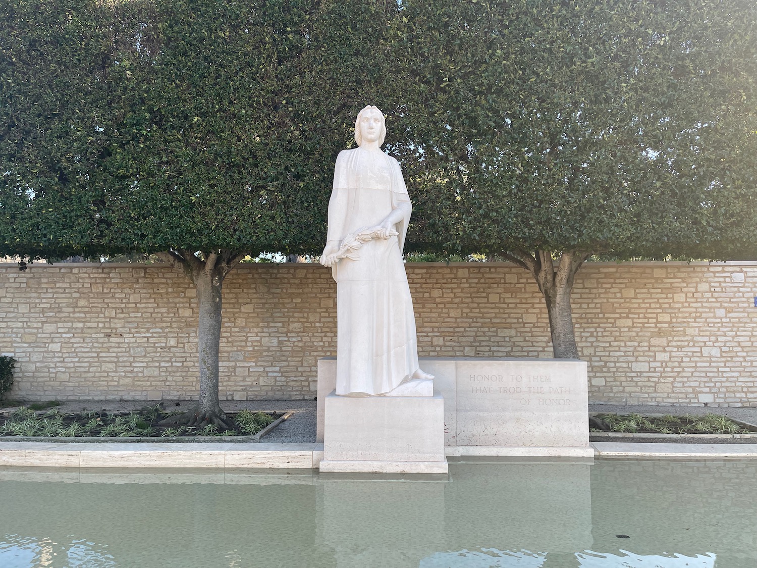 a statue of a woman in a white robe