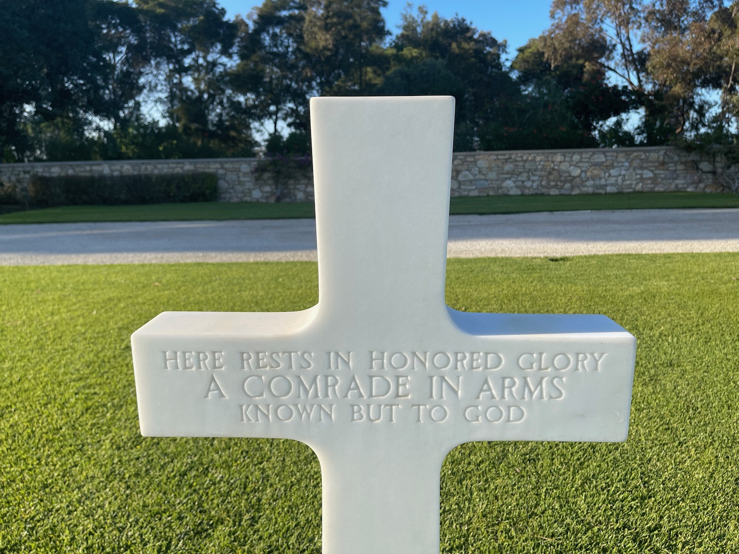 a white cross on grass