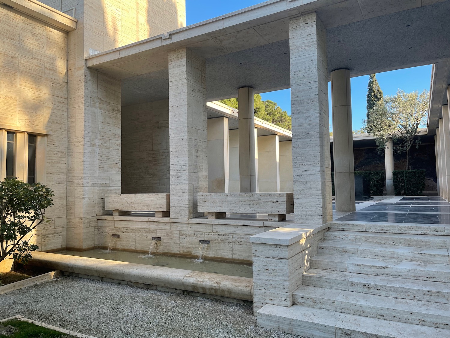 a stone building with a fountain