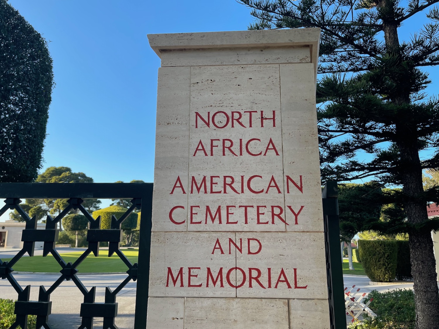 a stone sign with red writing on it