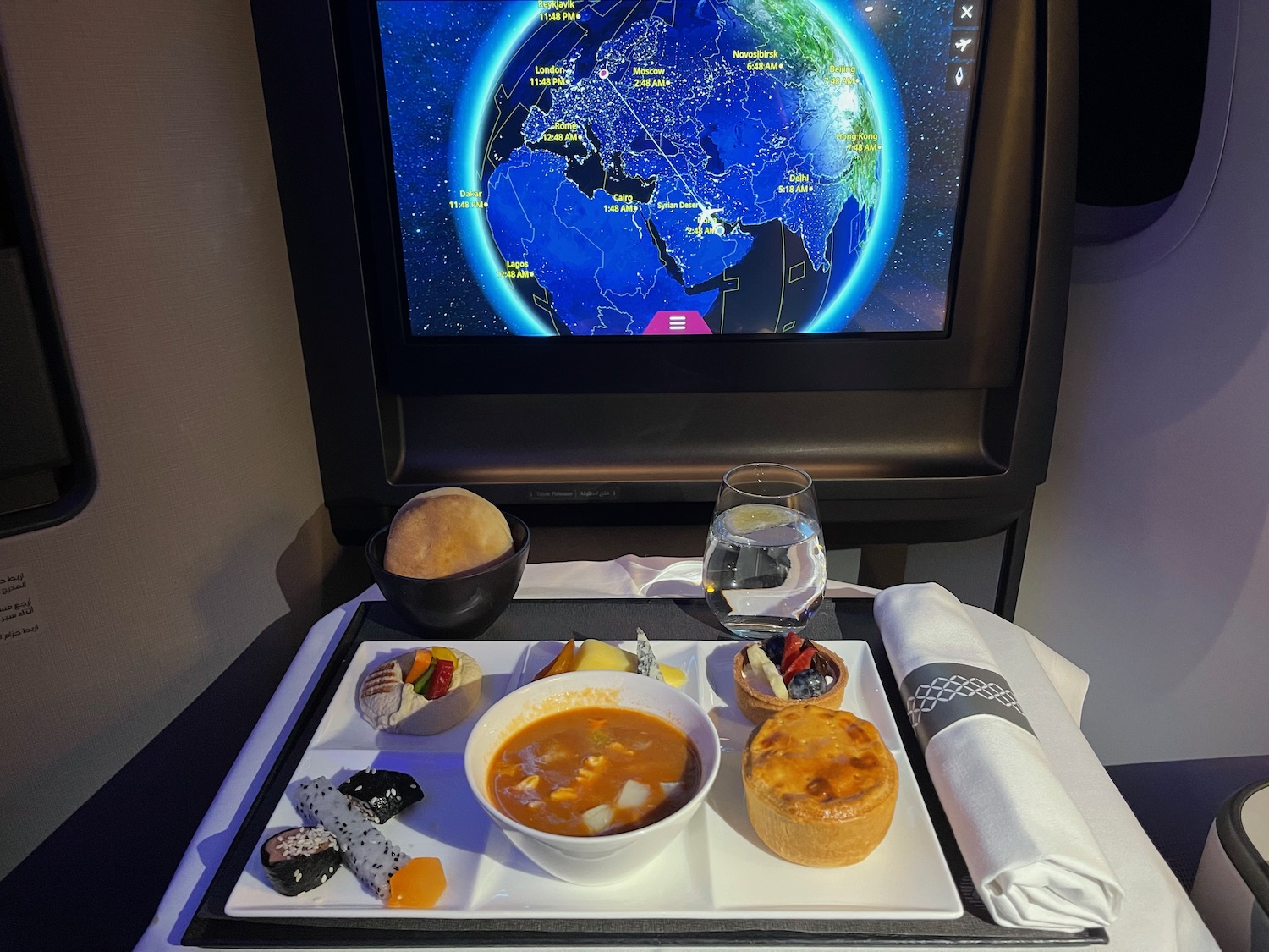 a tray with food on it and a television screen