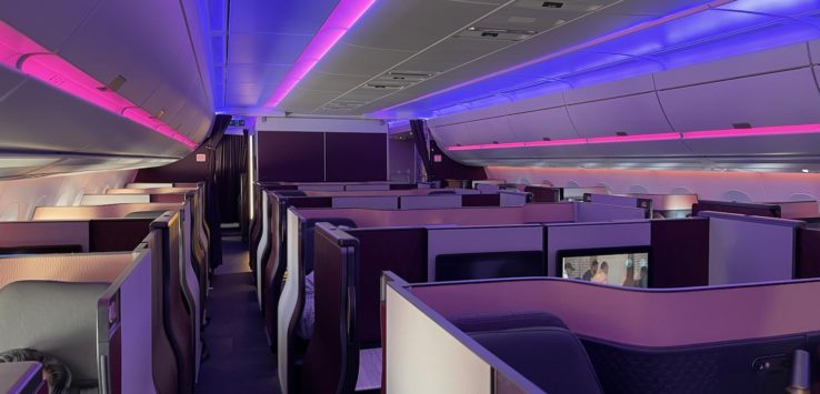 an airplane with purple and white seats