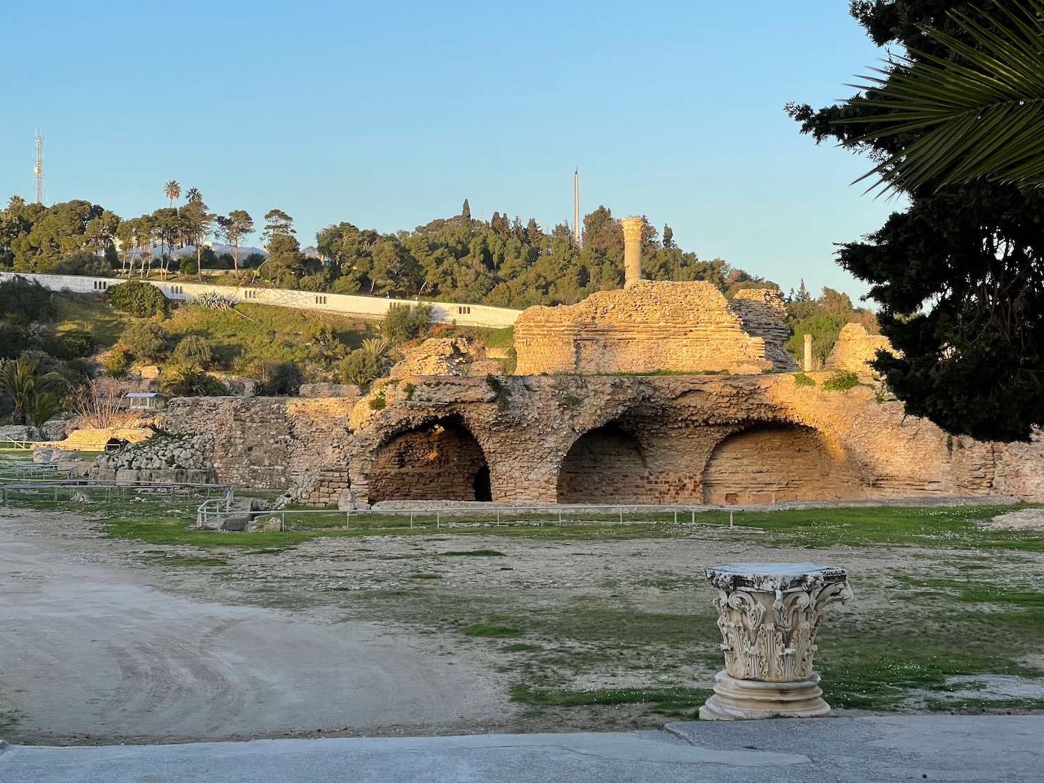 a stone structure with a stone column in the background