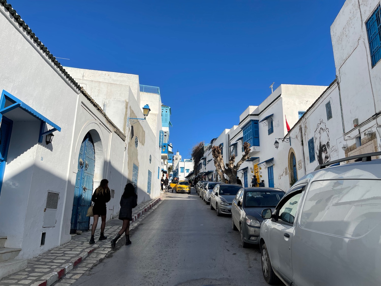 a street with cars and buildings