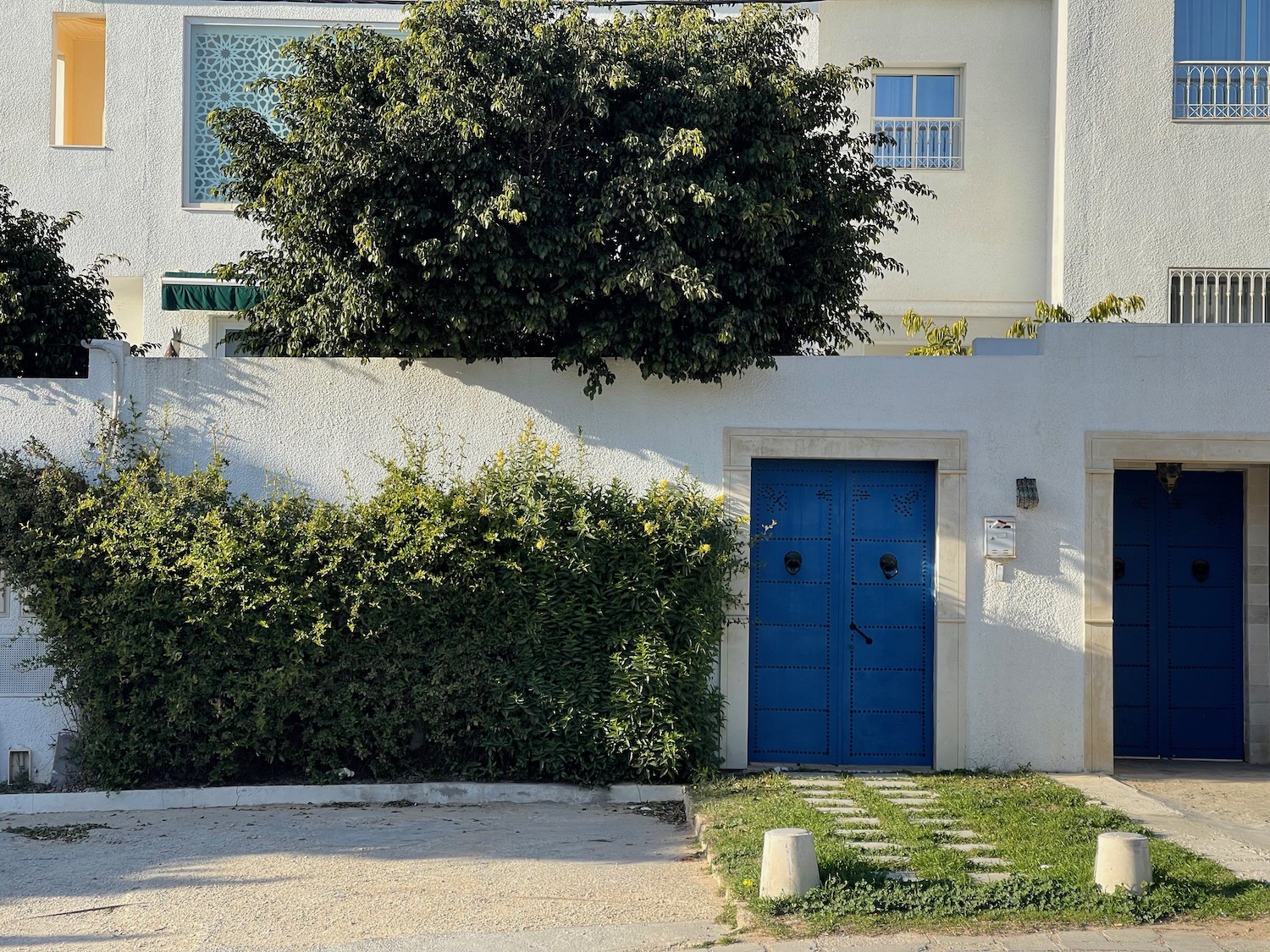 a blue door on a white building