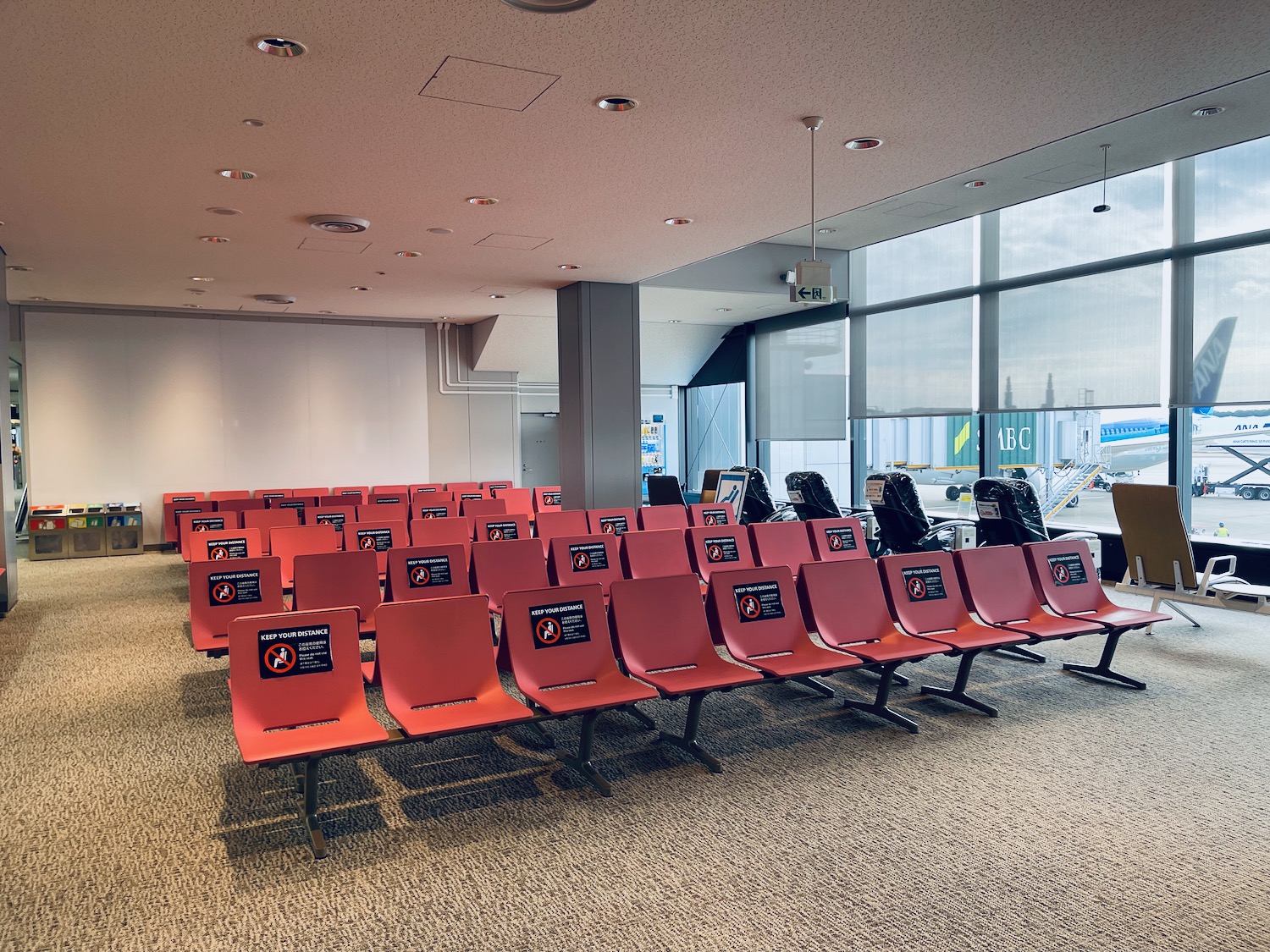 a row of red chairs in a room