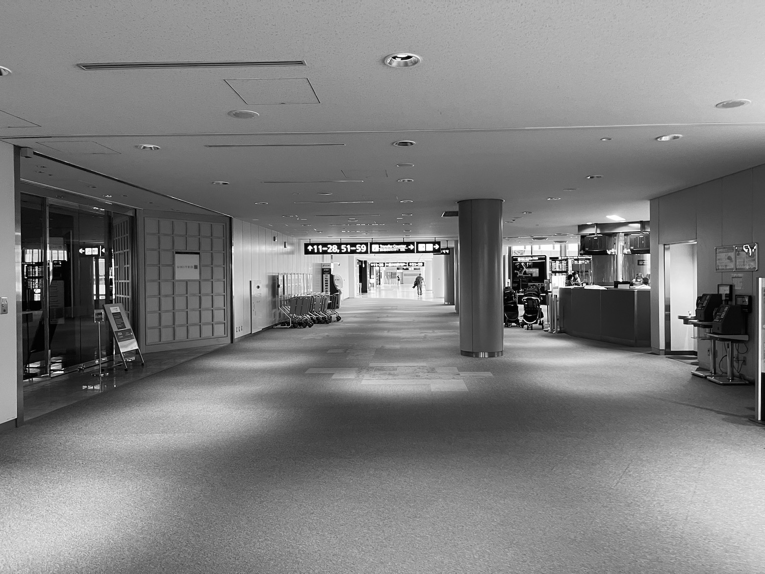 a black and white photo of a hallway