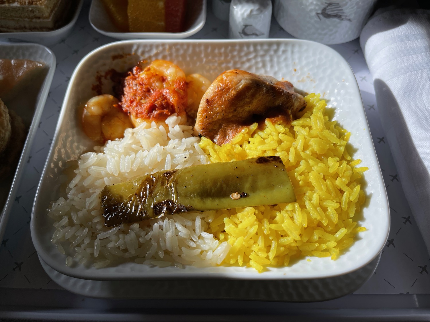 a plate of rice and meat