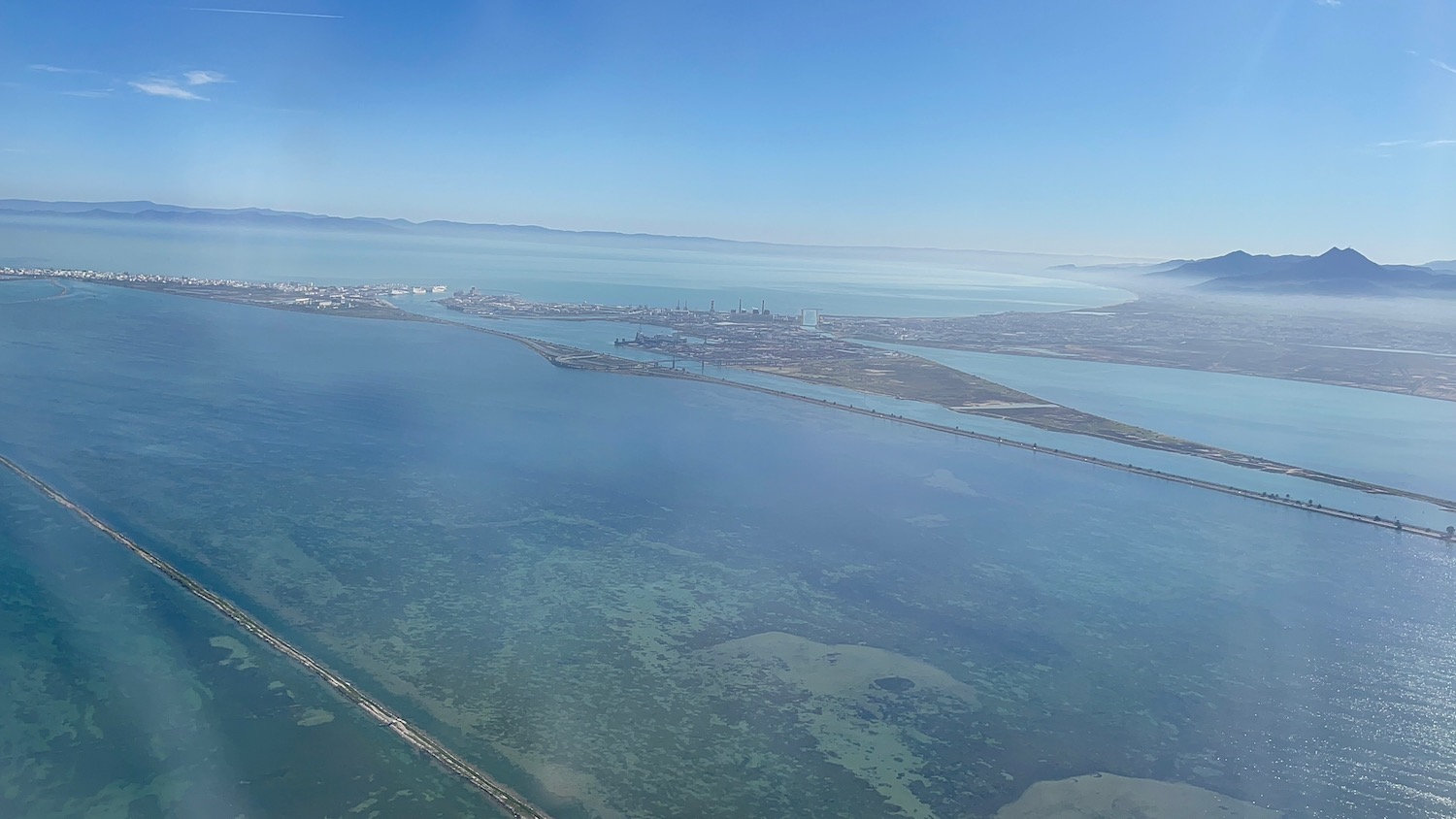 an aerial view of a city and water