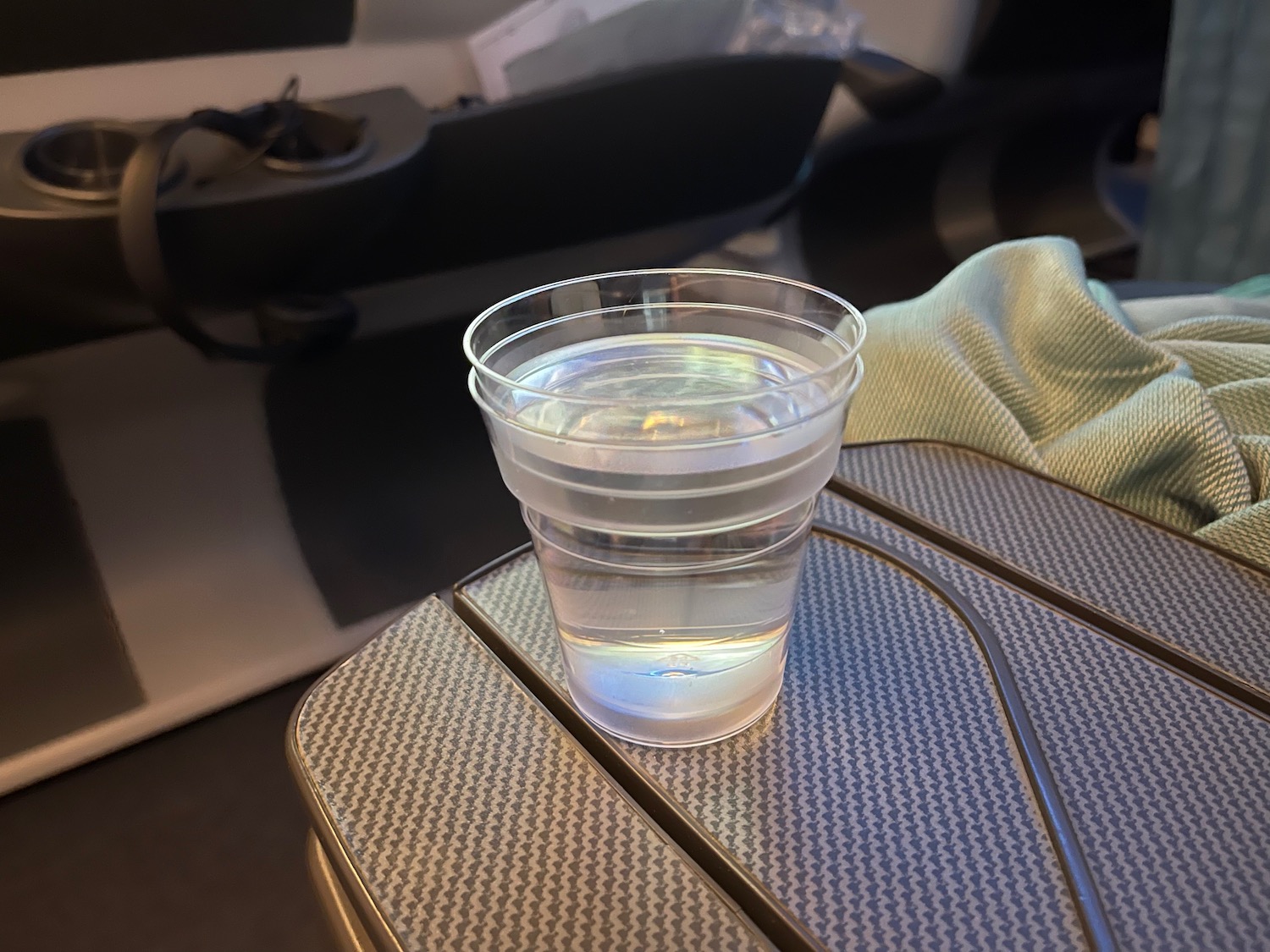 a plastic cup of water on a table