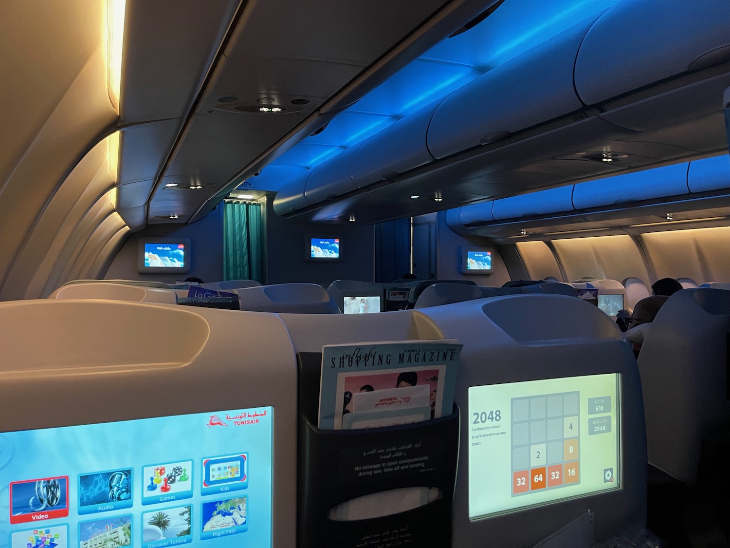 an airplane with a screen on the wall