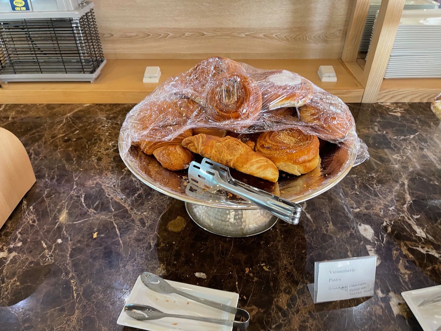 a bowl of pastries on a marble table