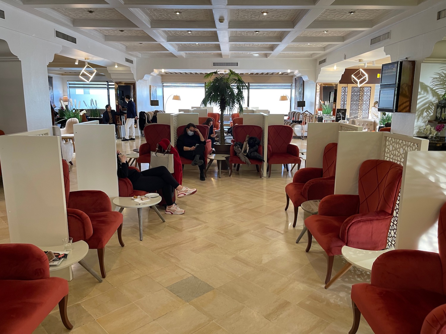 a room with red chairs and tables