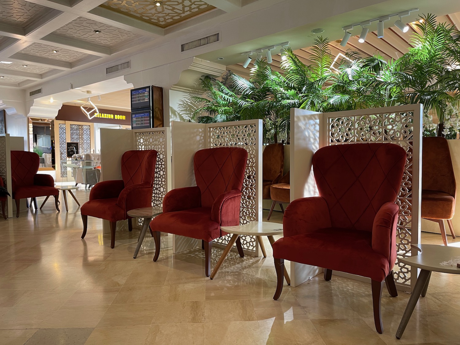 a room with red chairs and tables