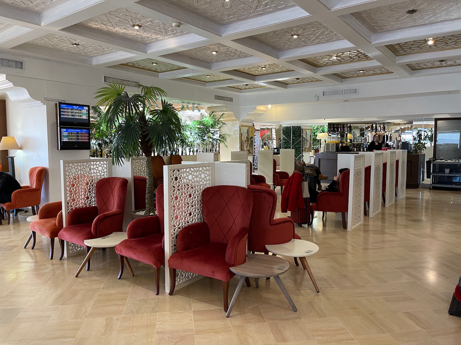 a room with red chairs and tables