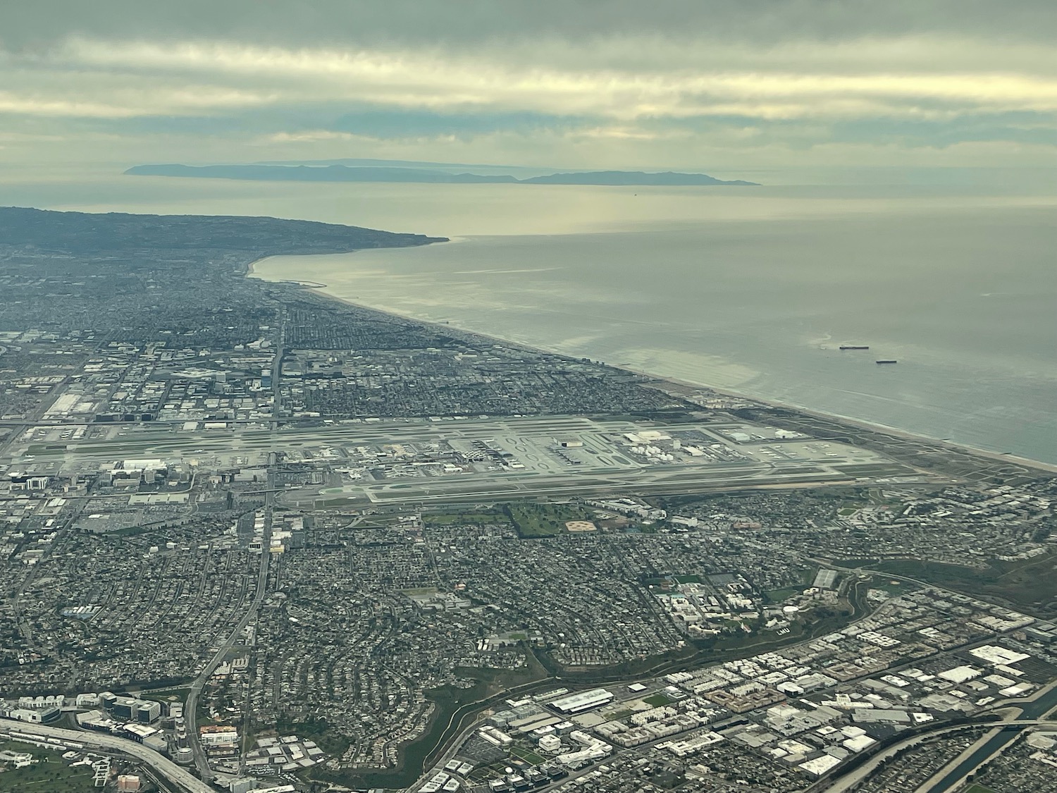 an aerial view of a city and the ocean