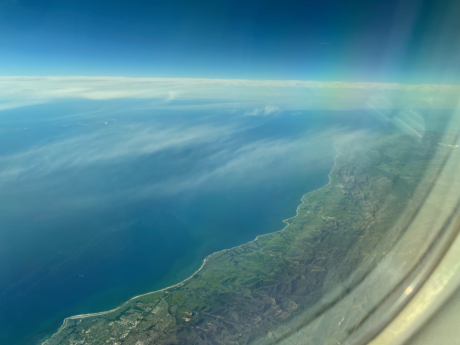 a view of the ocean from an airplane window