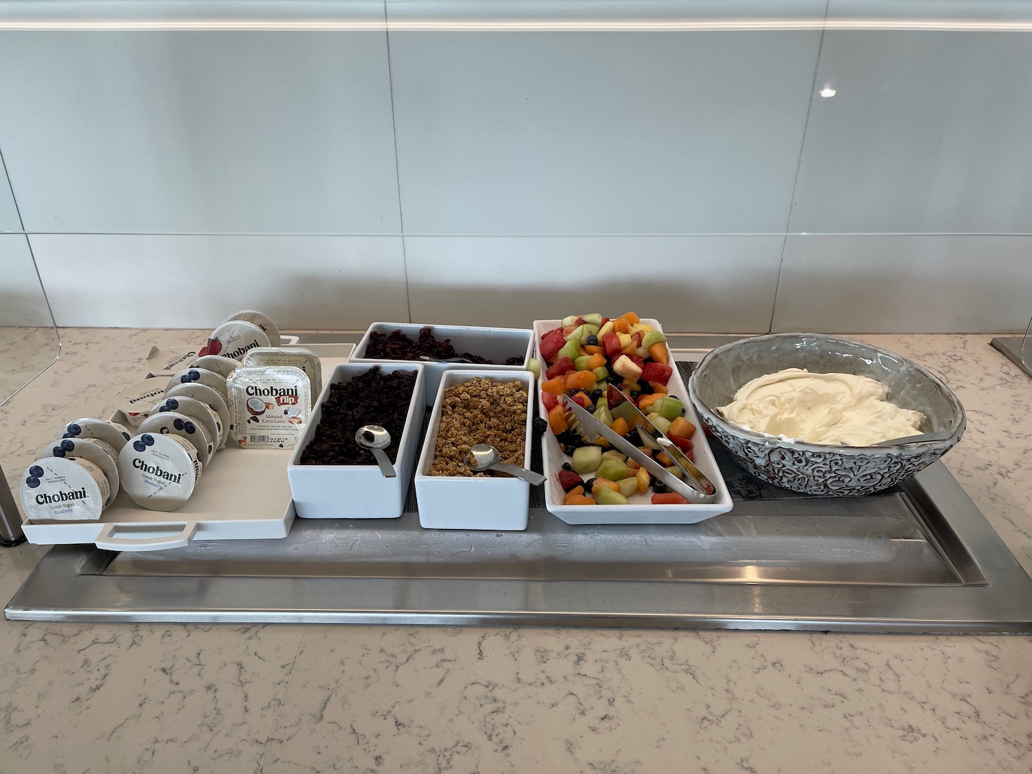 a tray of fruit and yogurt