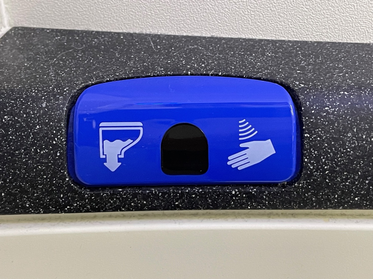 a blue button with a hand and a white hand