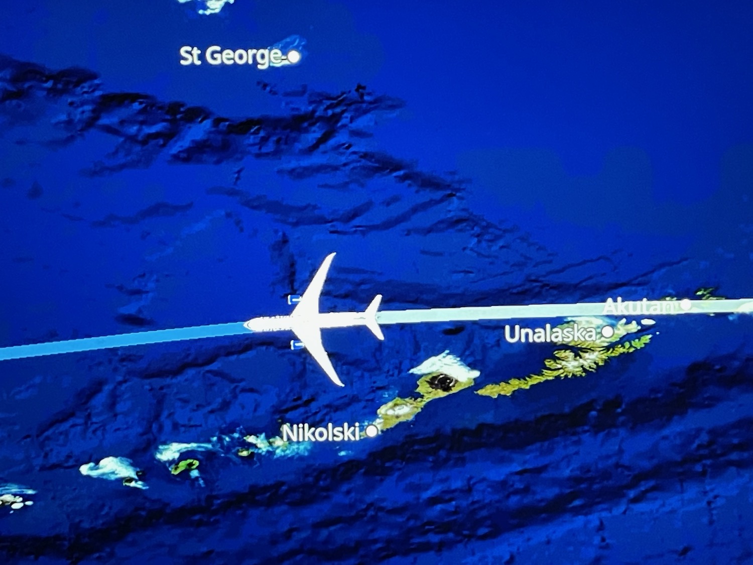 a plane flying over a map