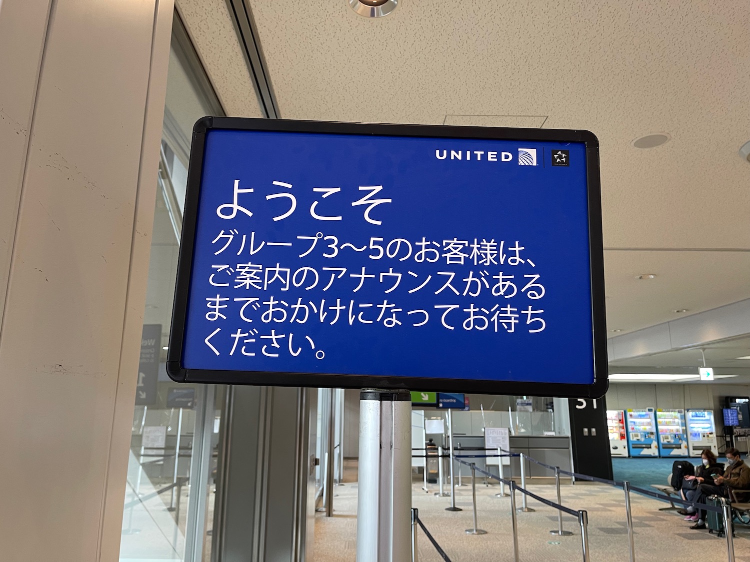 a blue sign in an airport