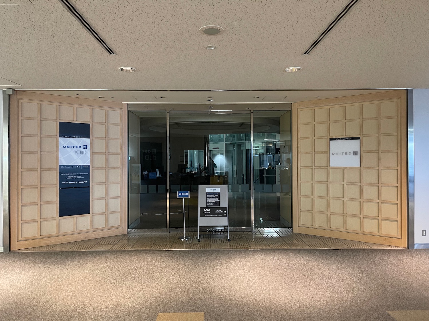 a glass door with signs in front of it