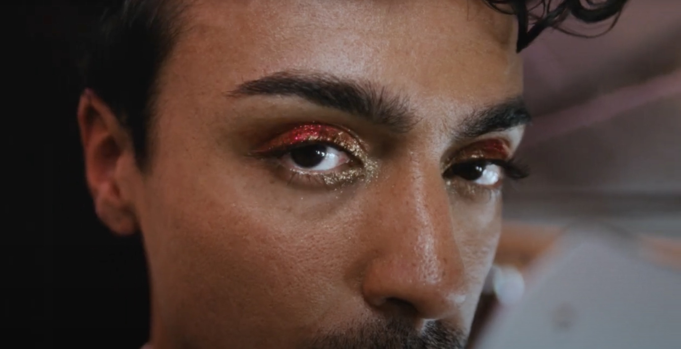 a man with glittery eyes