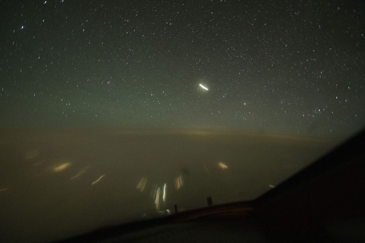 a view of the night sky from a plane window
