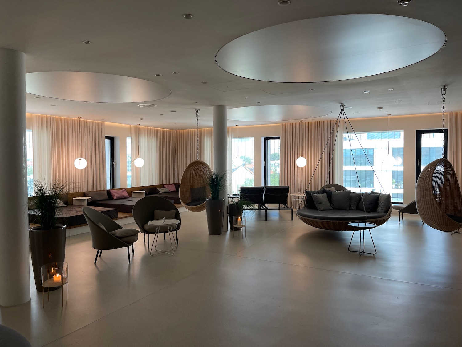 a room with a round ceiling and a round chandelier