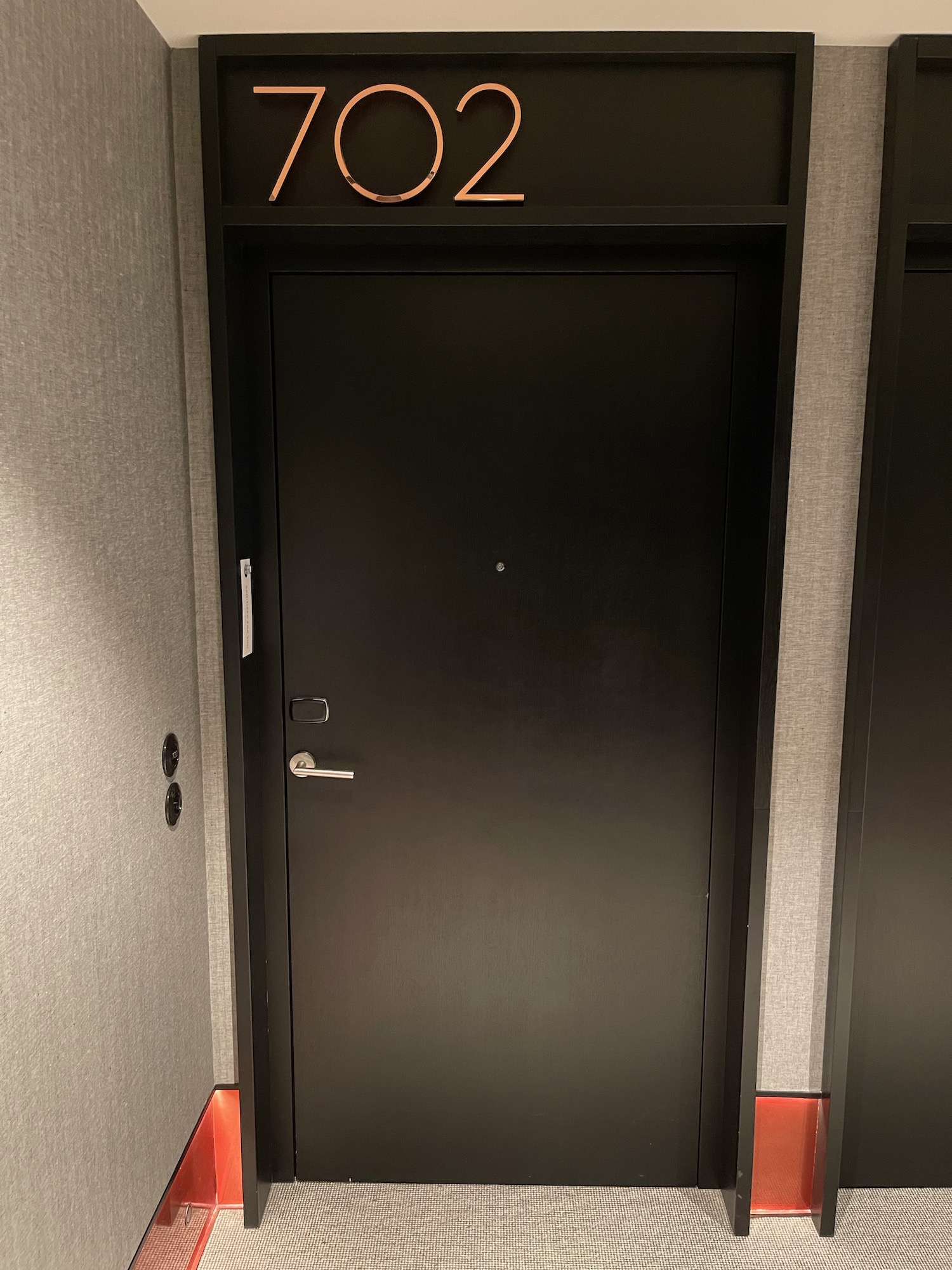 a black door with numbers on it