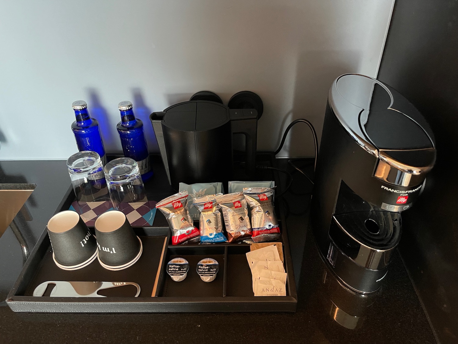 a coffee machine and coffee cups on a table