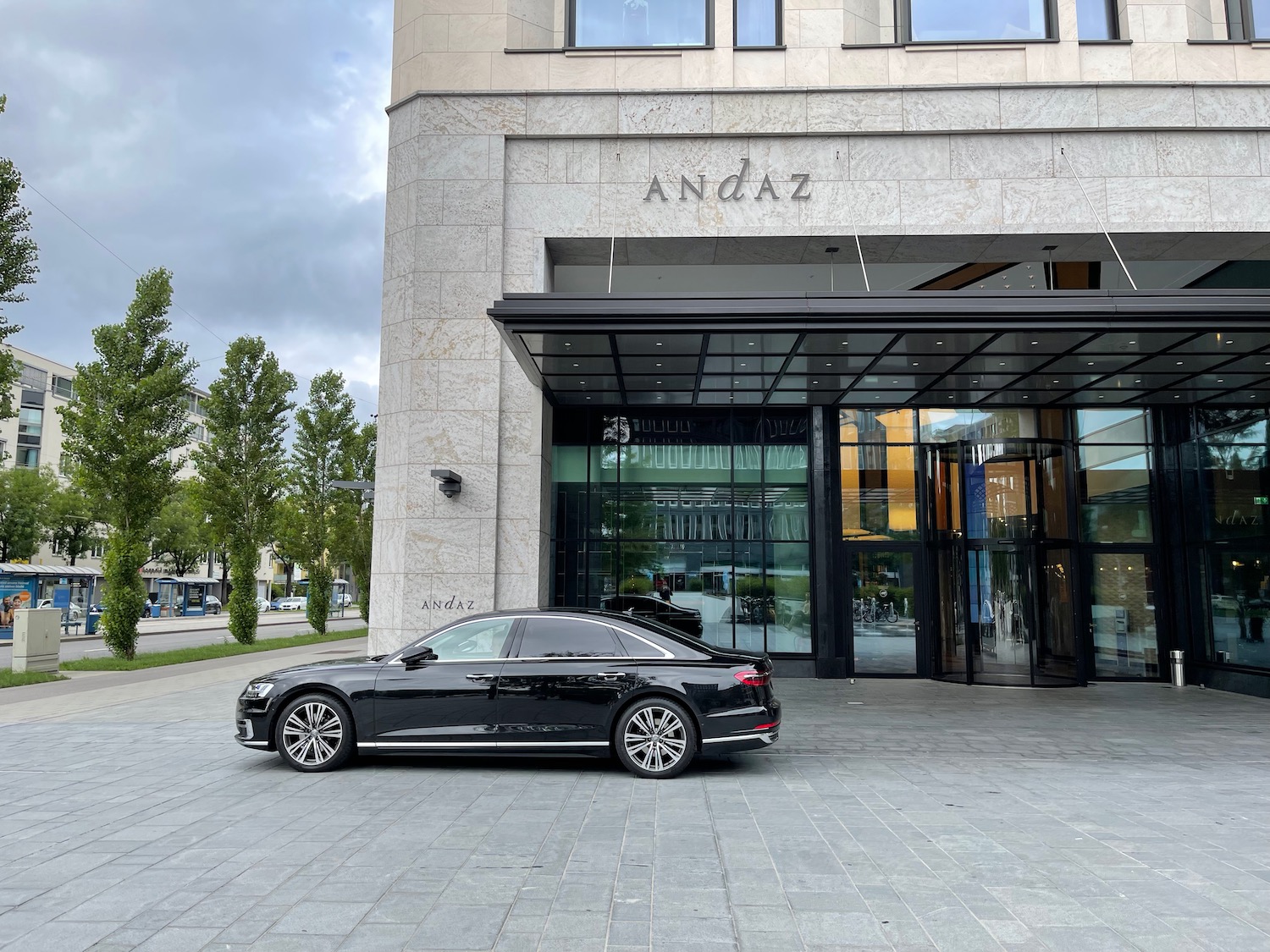 a black car parked in front of a building