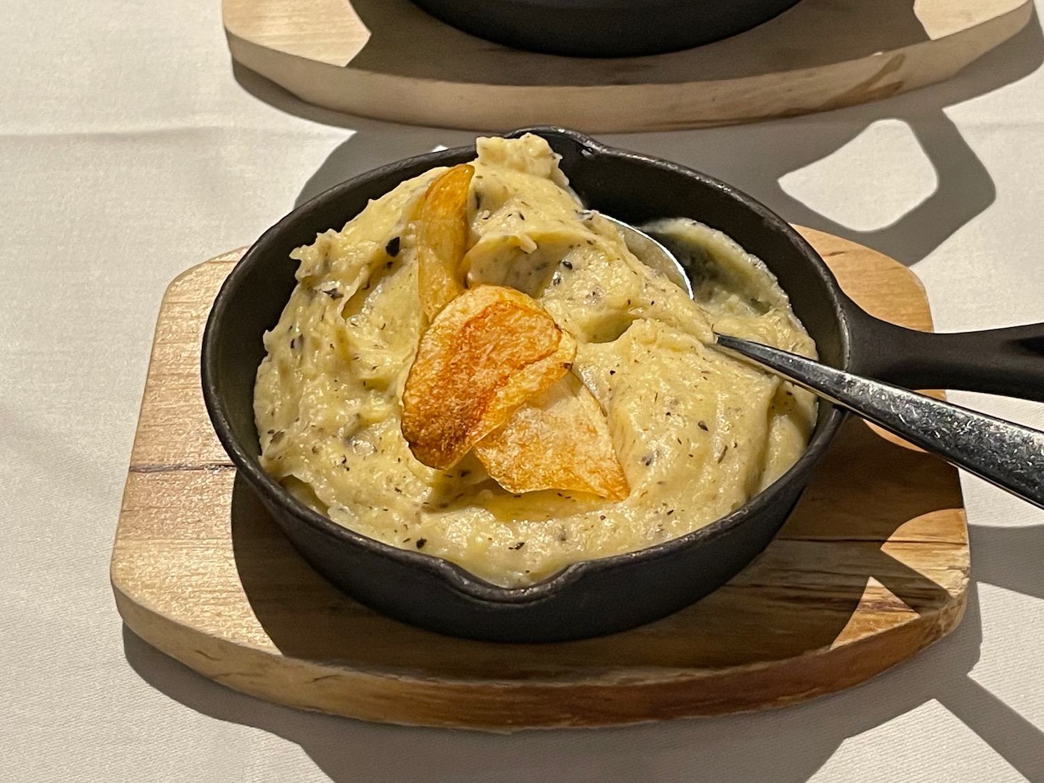 a pan of food with a spoon