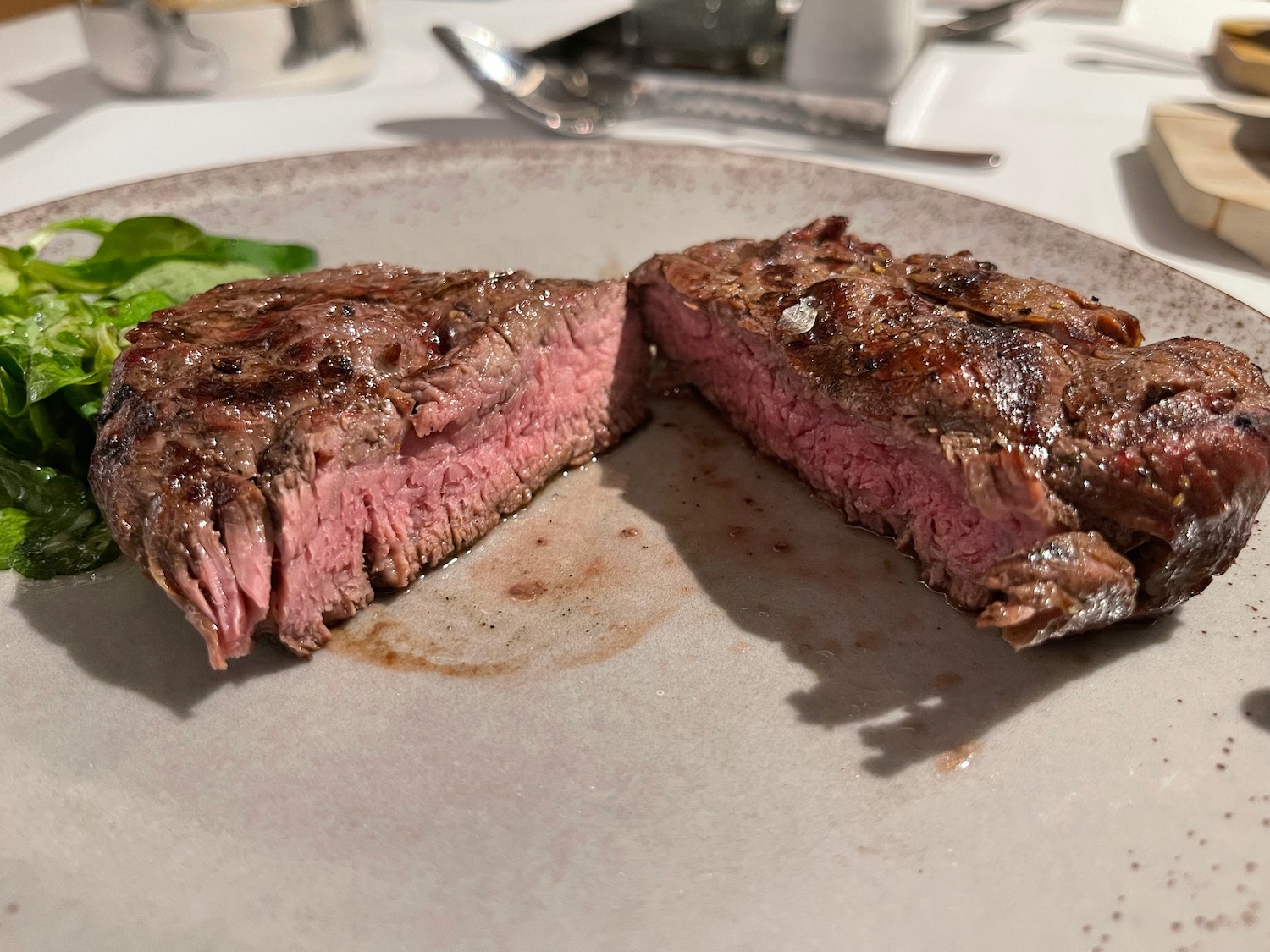 a steak cut in half on a plate