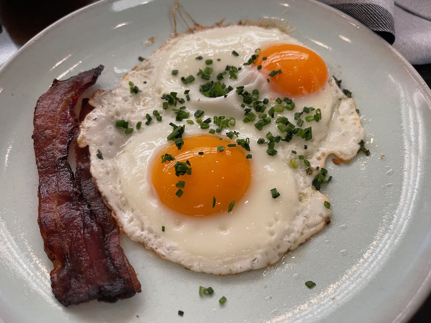 a plate of eggs and bacon