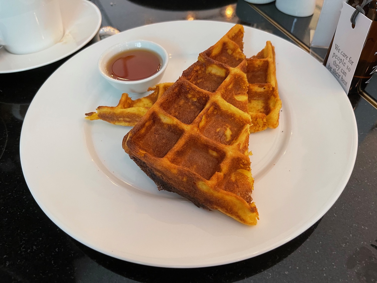 waffles on a plate with syrup on it