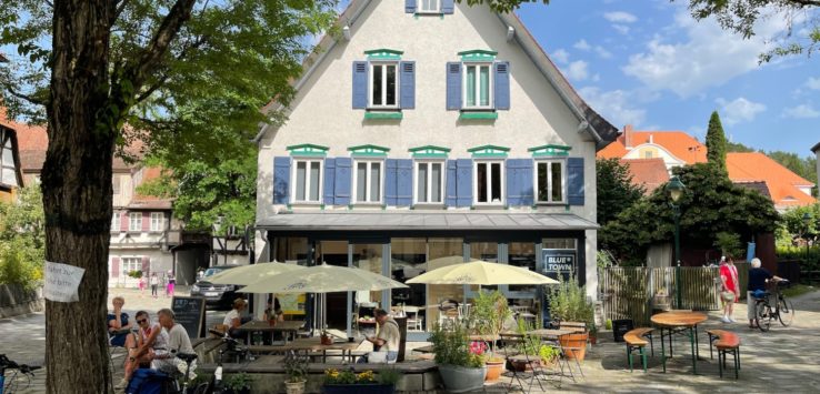 a building with a group of people sitting outside