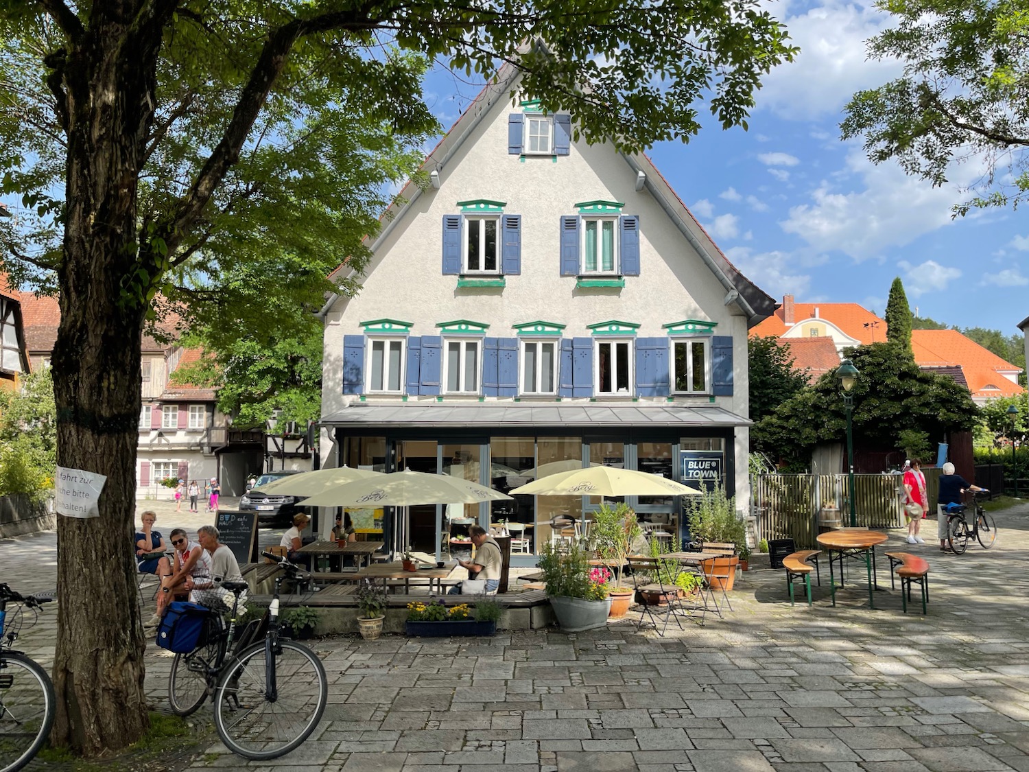 a building with a group of people sitting outside