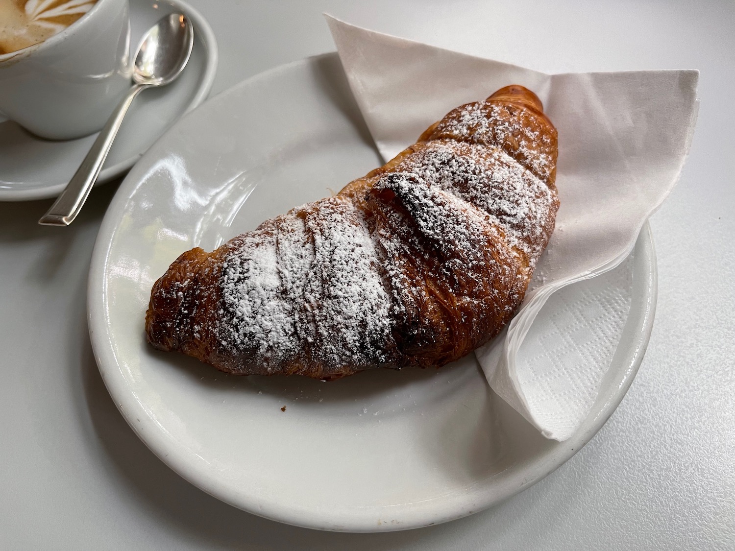 a croissant on a plate