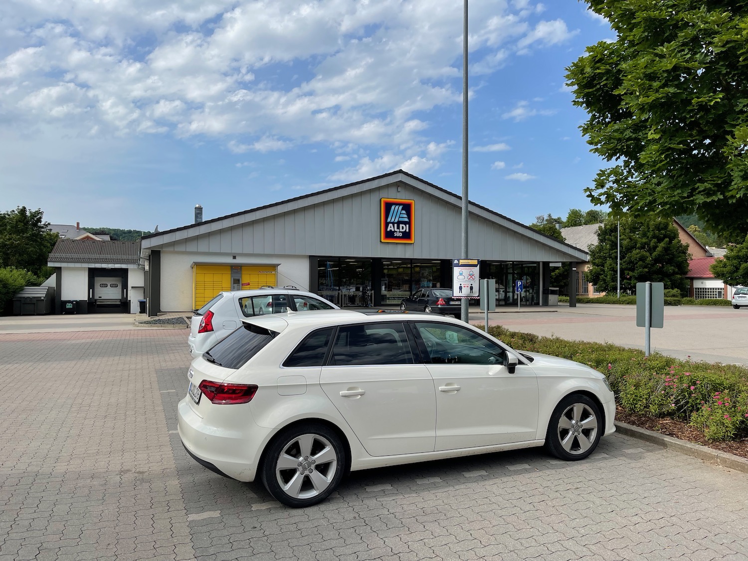 a white car parked in a parking lot