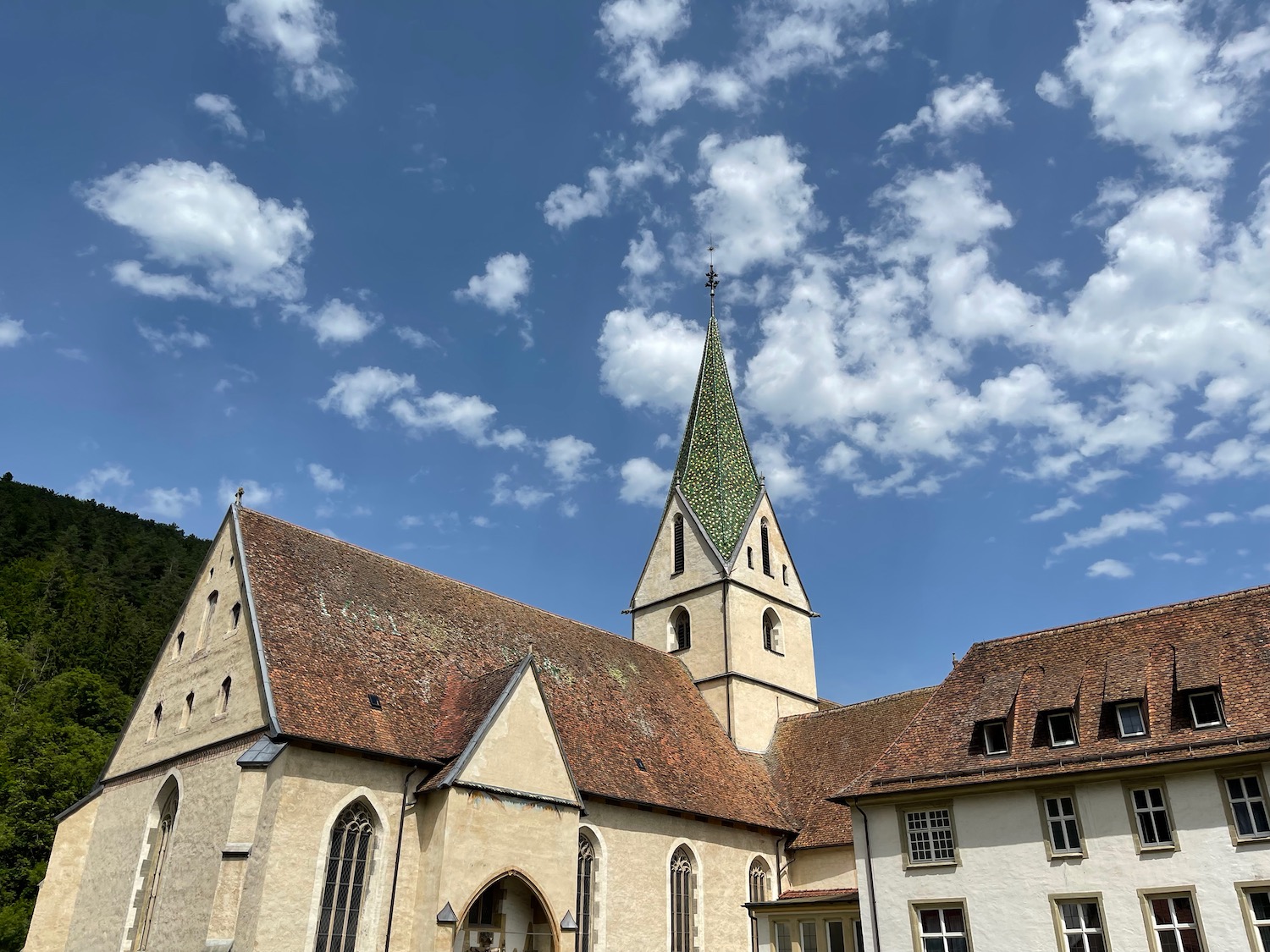 a building with a steeple and a blue sky