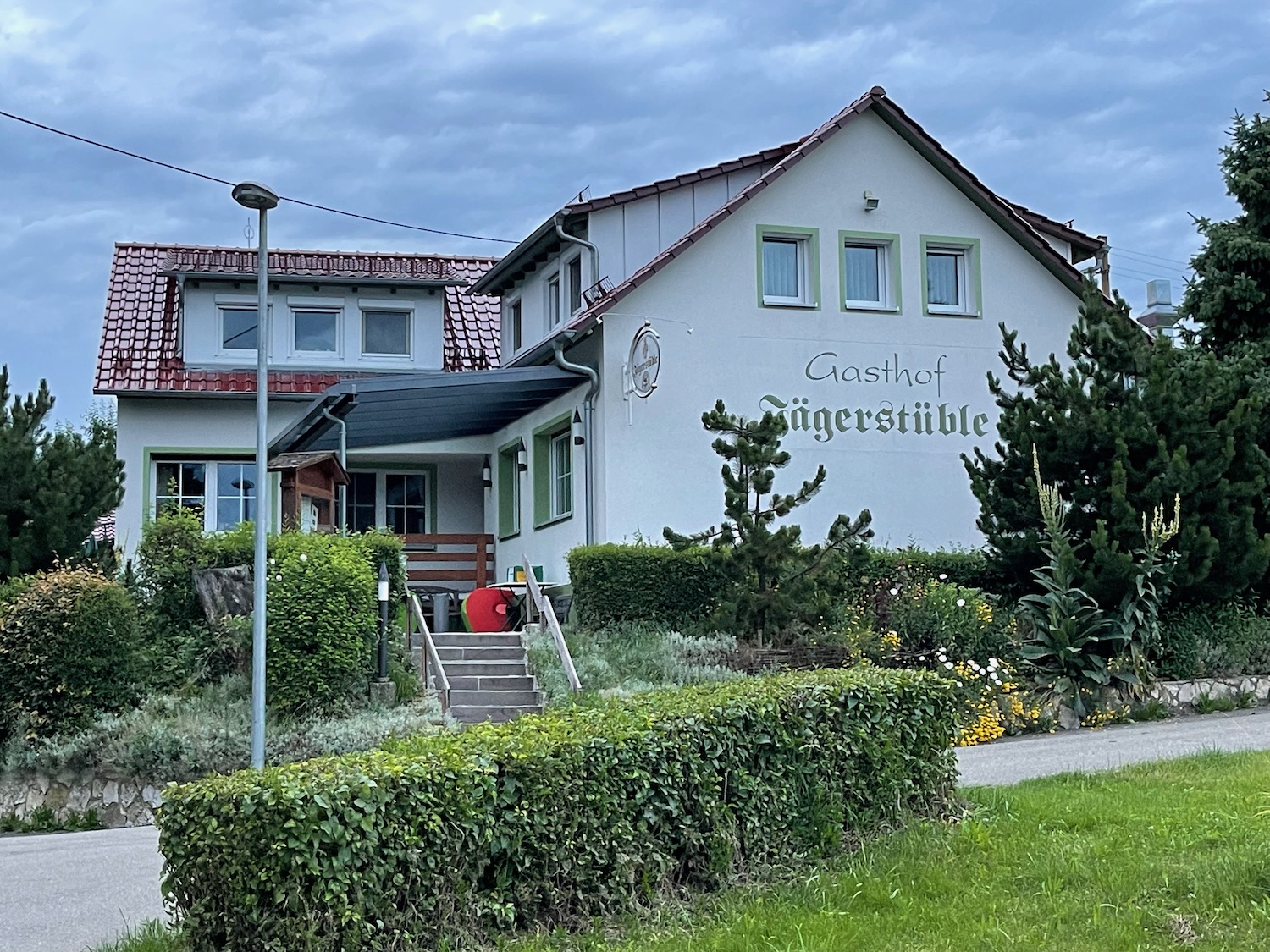 a house with a garden and bushes