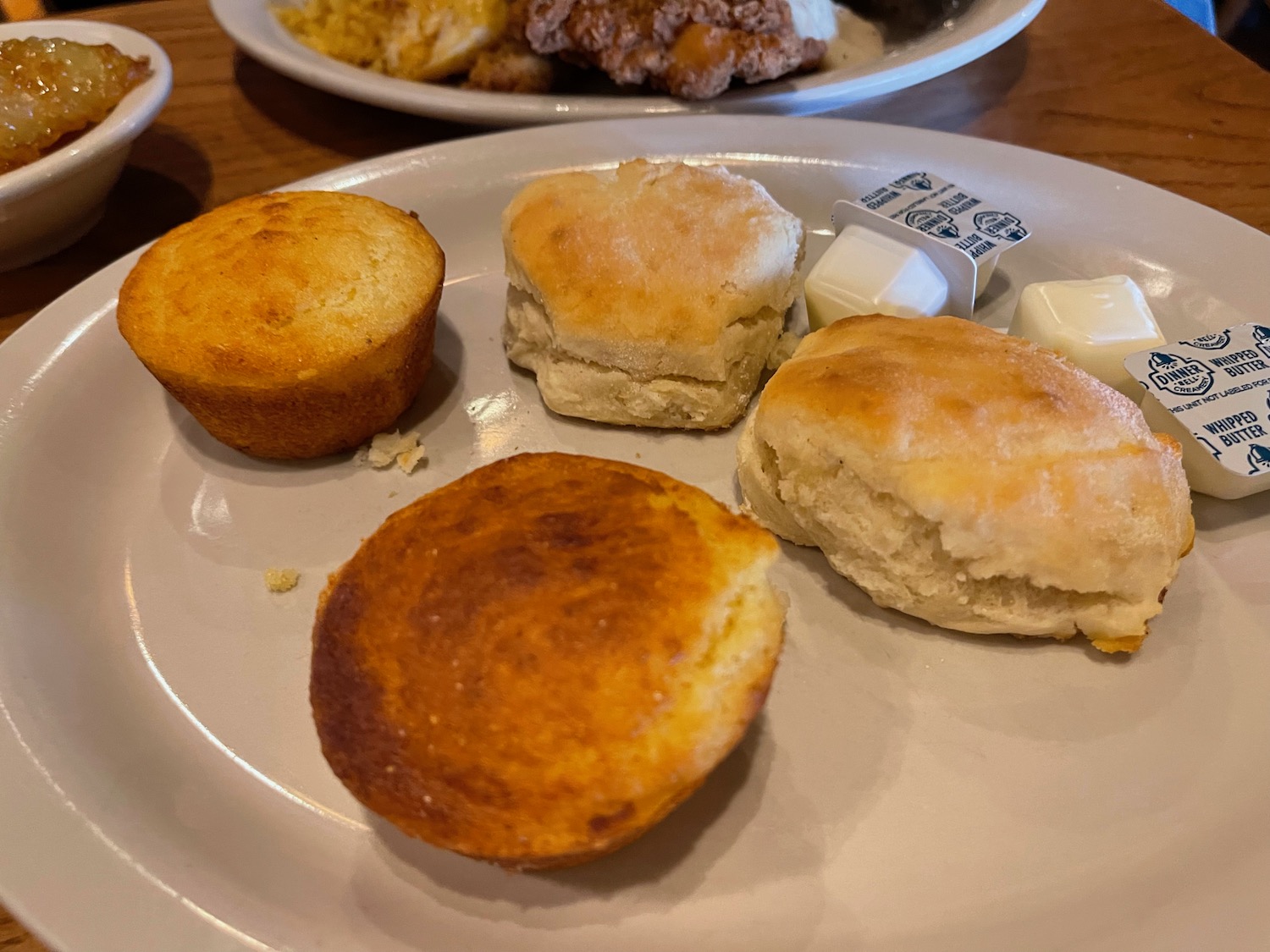 a plate of biscuits and muffins