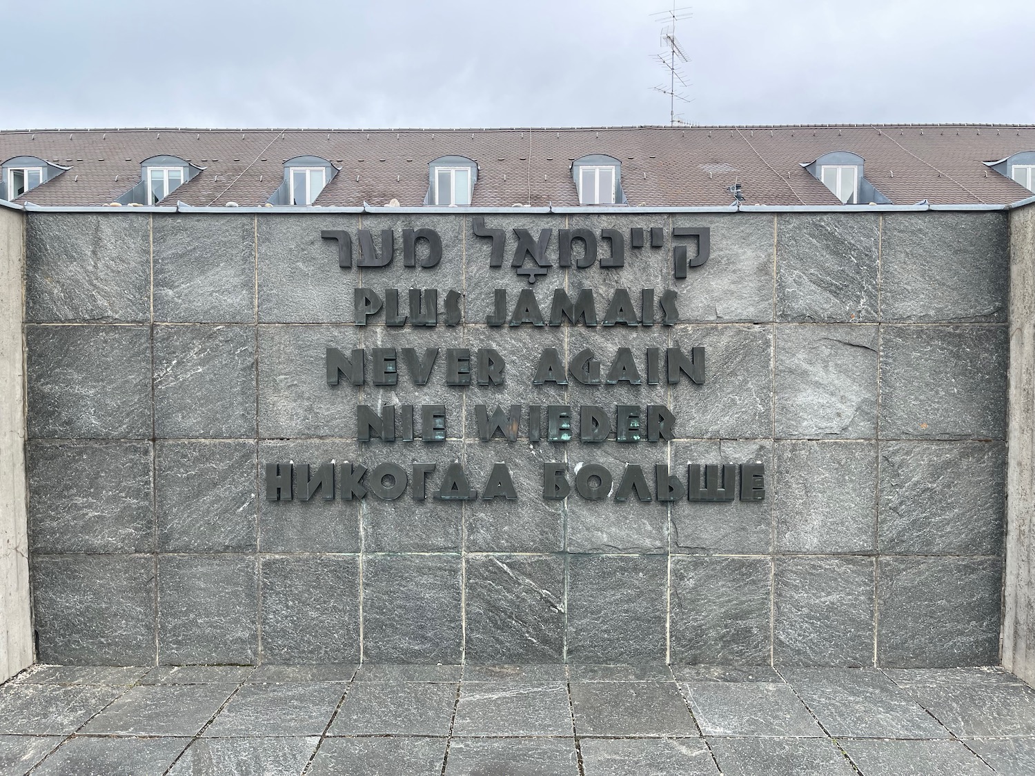 a stone wall with black text