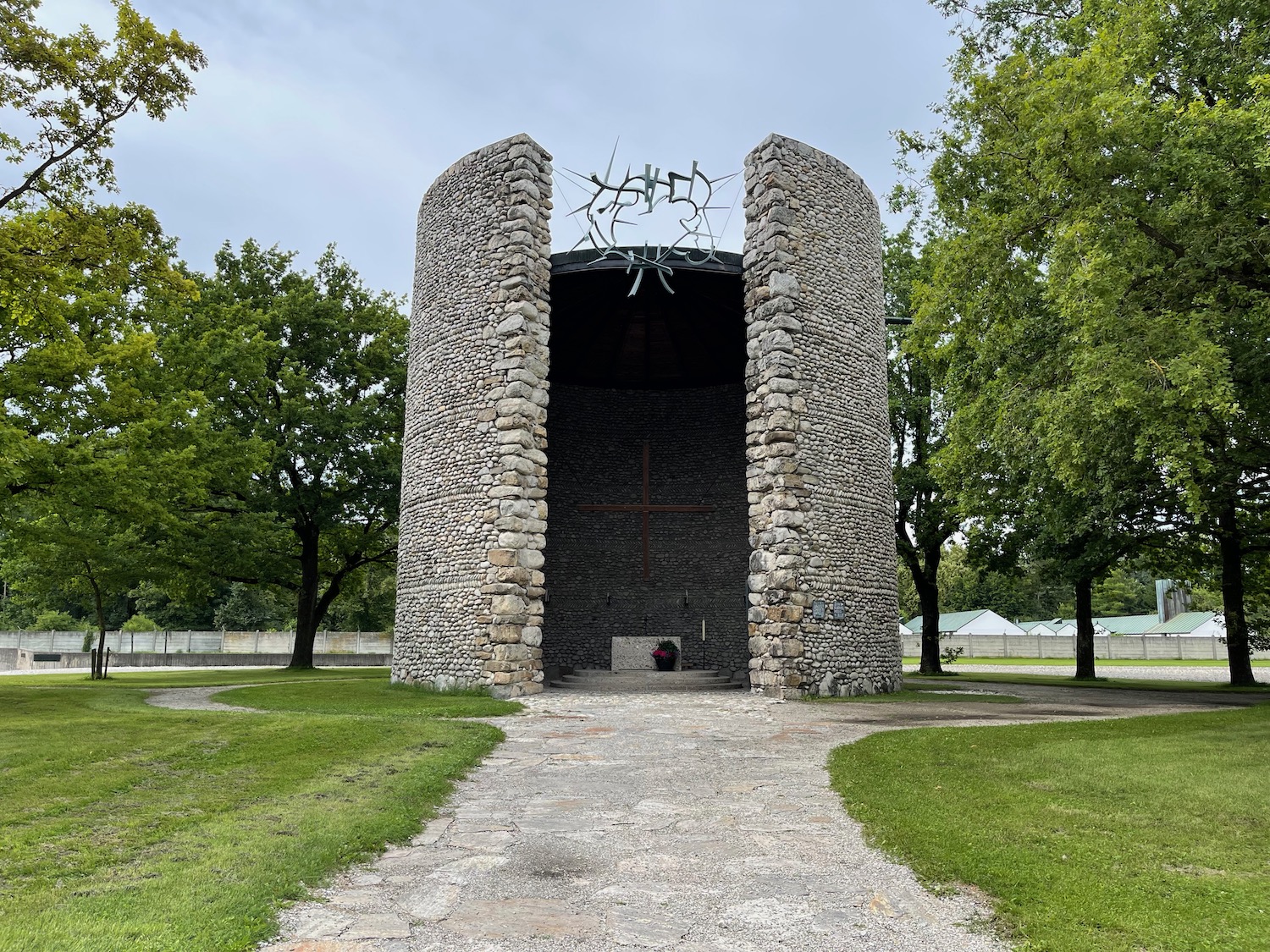 a stone structure with a cross on top