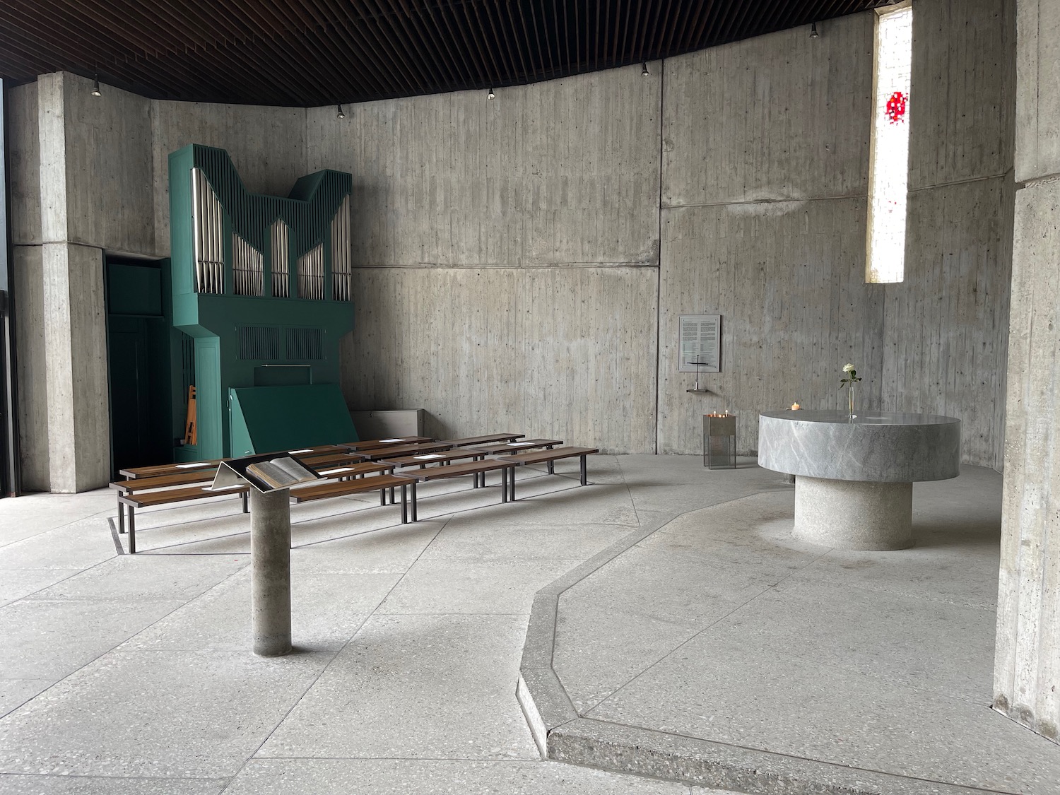 a stone altar with benches and a stone bowl